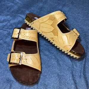 Brand New w/o box size 6 hand tooled genuine leather sandals with gold buckles.